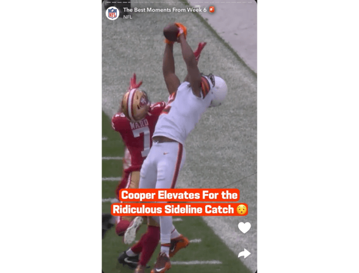 Screenshot of a Snapchat Story by the NFL that features a football player jumping up to catch the ball on the sideline.