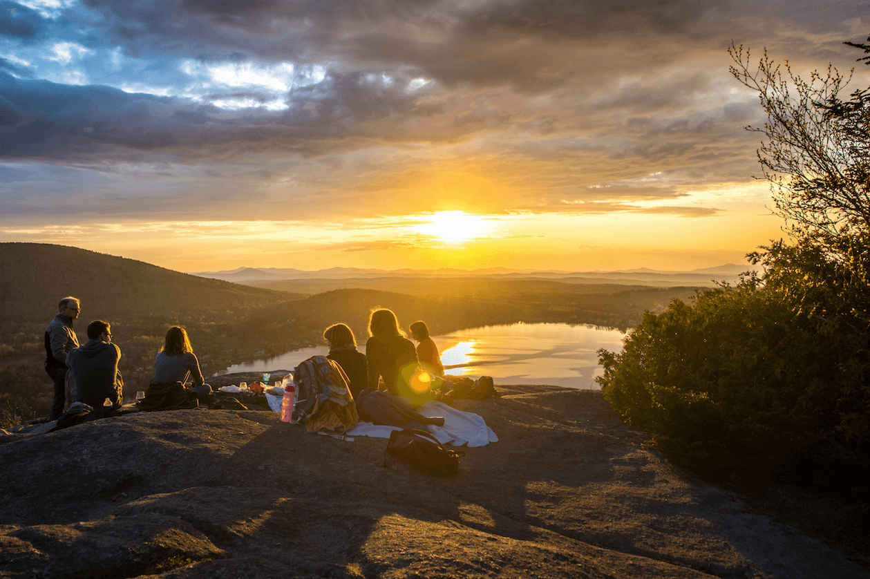 Community of people watching the sunset