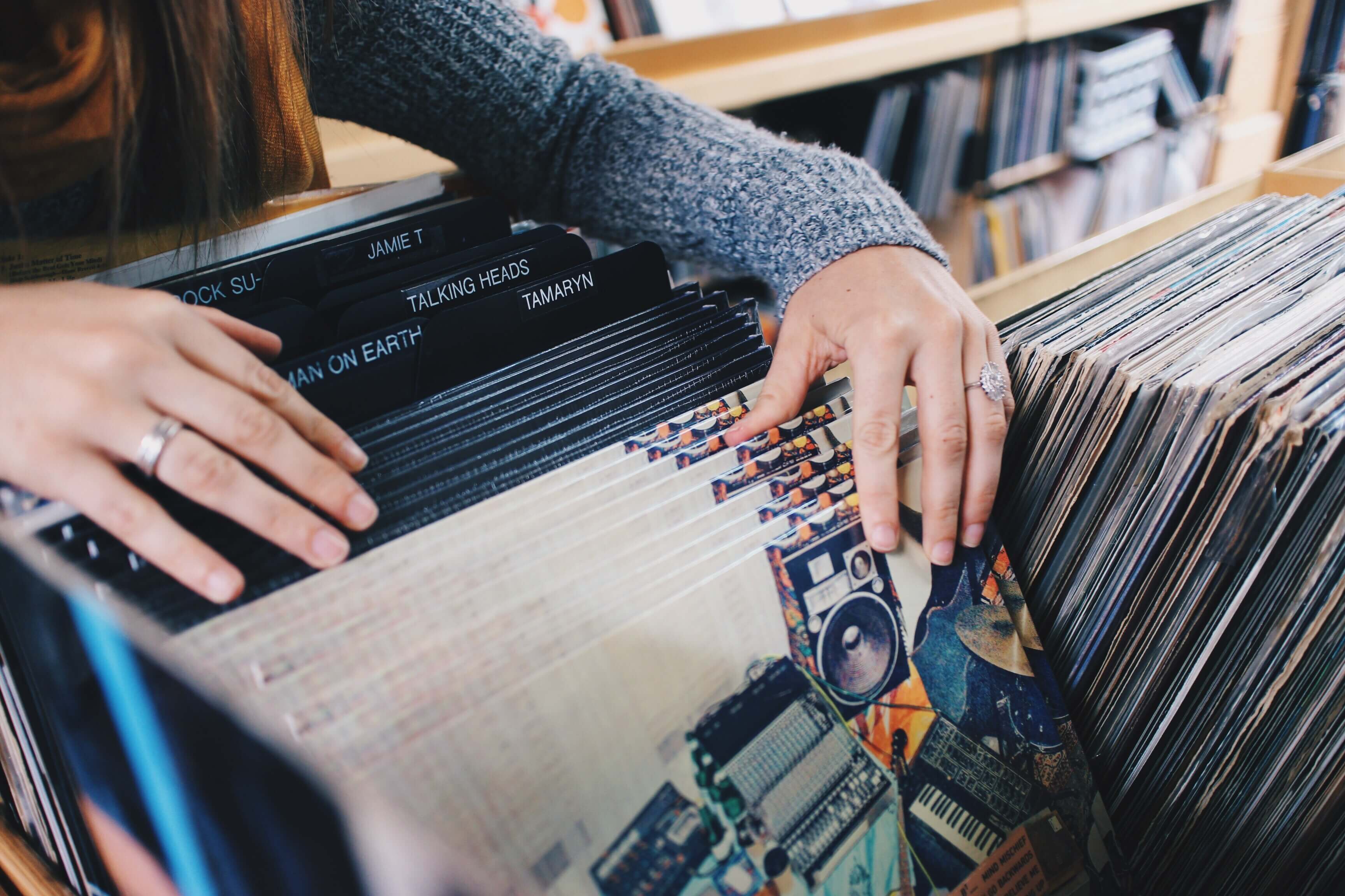 Consumer looking through records - Word of mouth marketing is marketing you can trust