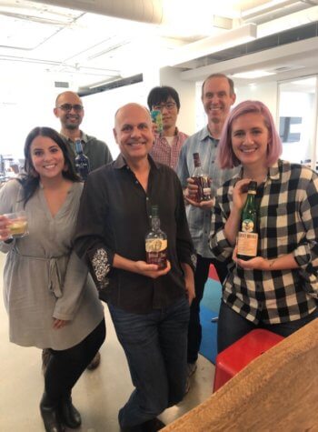 Rival IQ team holding all the alcohol brands profiled in this report