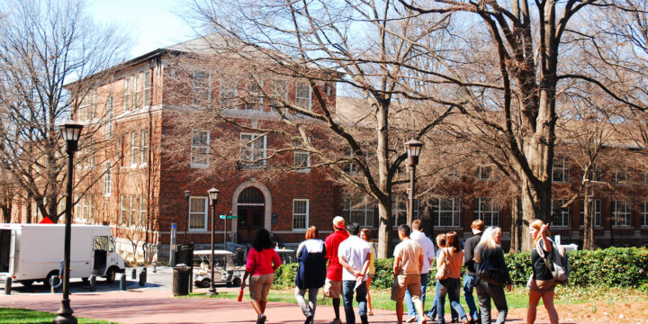 University scene with students walking around on campus