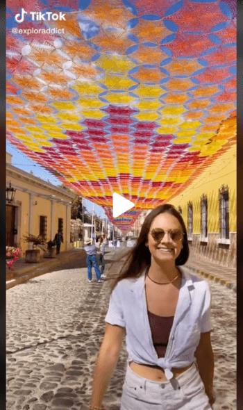 TikTok micro-influencer Maxine Senior's walking under the largest crochet that covers an entire town in Mexico. TikTok handle @exploraddict 