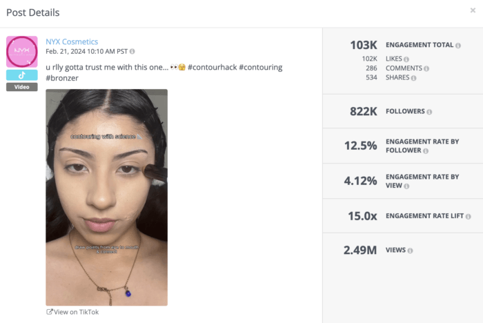 NYX Cosmetic's video thumbnail has a model holding up contouring brushes to her face.