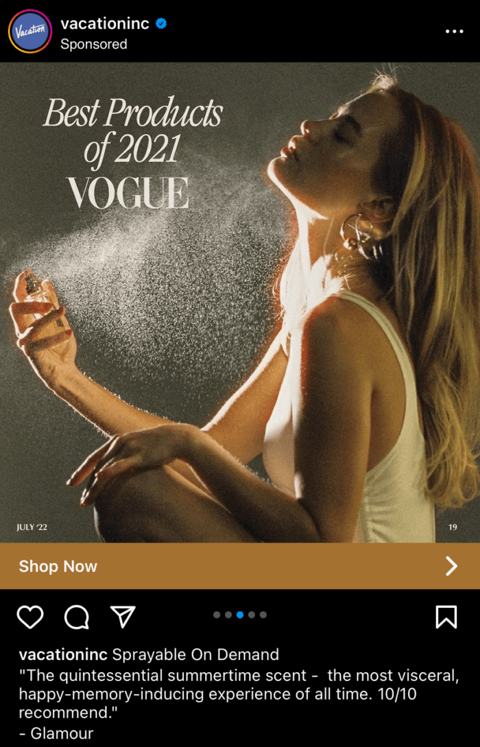 Another slide in Vacation's carousel ad which shows a woman spraying the perfume on her and text that says "best products of 2021 Vogue" which demonstrates social proof.